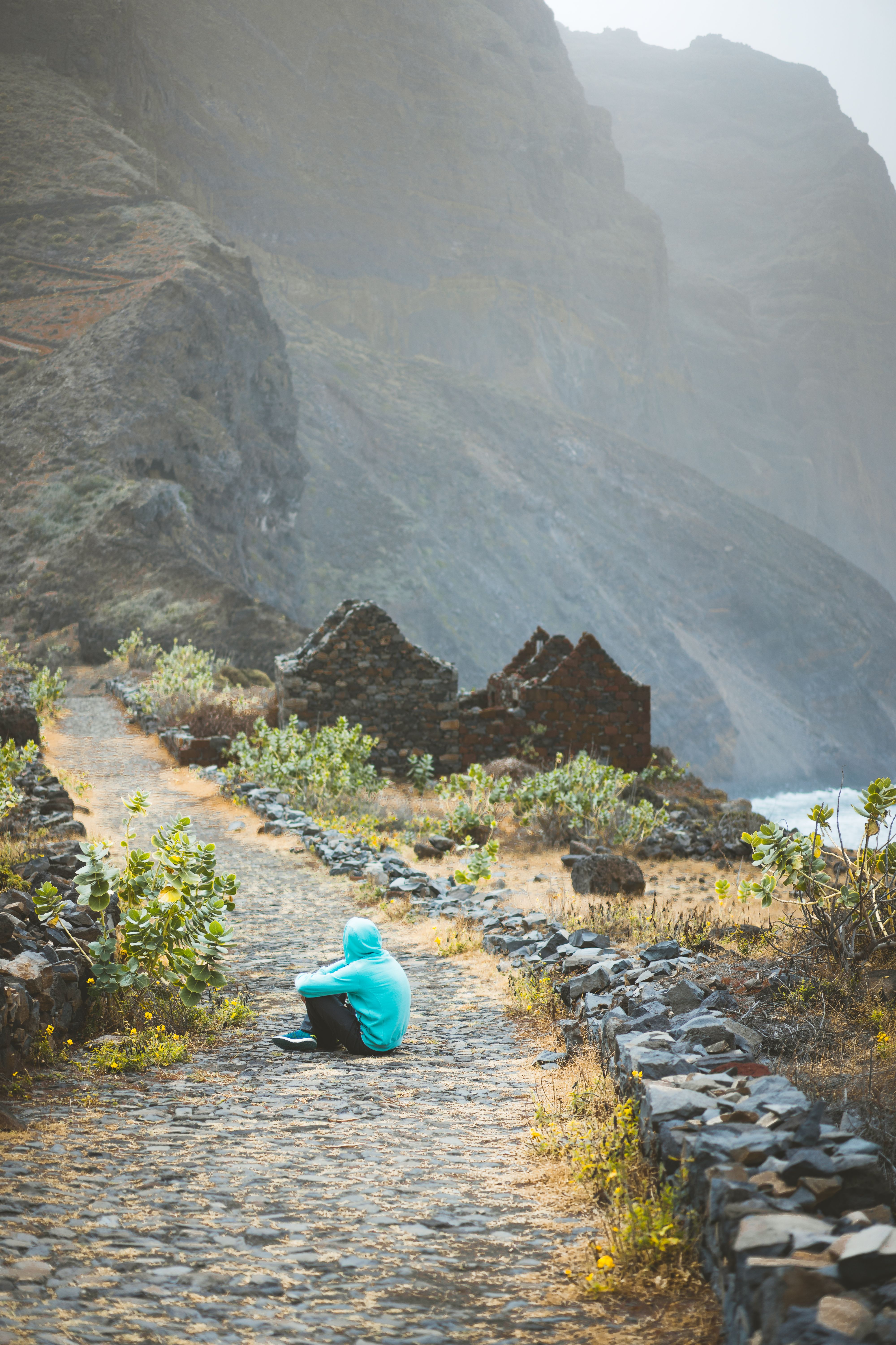 traveler-in-hoodie-sitting-in-aranhas-valley-in-fr-2024-10-18-05-33-55-utc.jpg